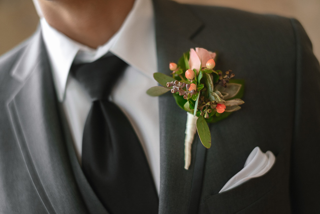 the groom's boutonniere | photo: Photos by Kristopher | via https://emmalinebride.com