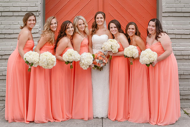the bridesmaids wore pink strapless chiffon gowns | photo: Photos by Kristopher | via https://emmalinebride.com