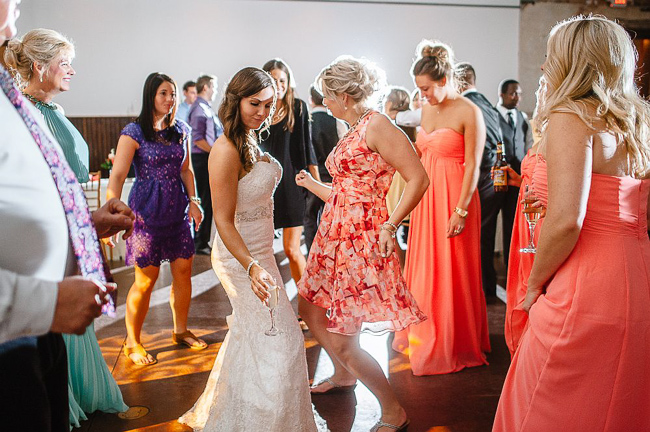 guests dance at the reception | photo: Photos by Kristopher | via https://emmalinebride.com