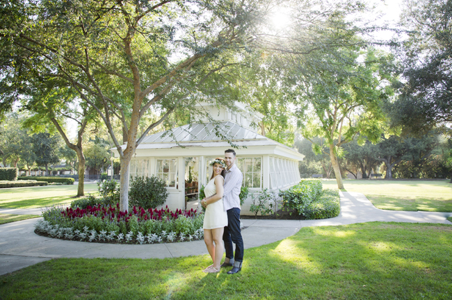 Santa Fe Springs Engagement Session couple stand in front of greenhouse
