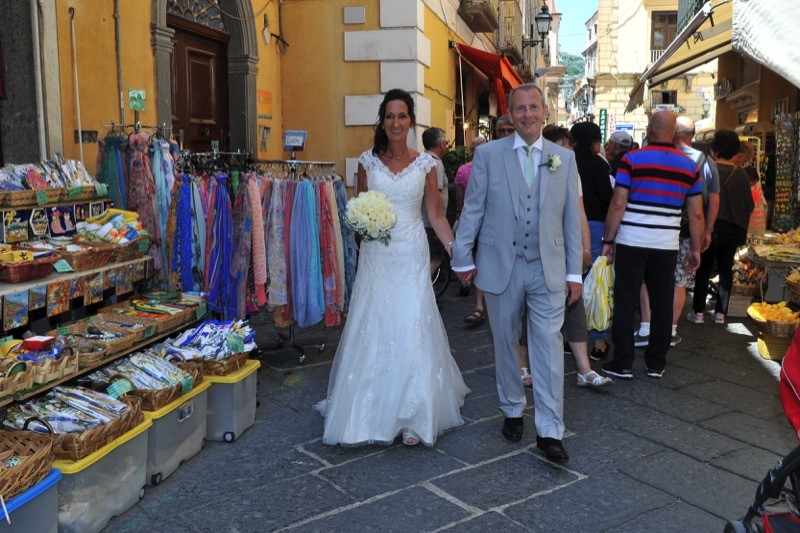bride and groom walking the streets of Sorrento, Italy| Planner: Venice Events | via https://emmalinebride.com/real-weddings/italian-weddings-destination/
