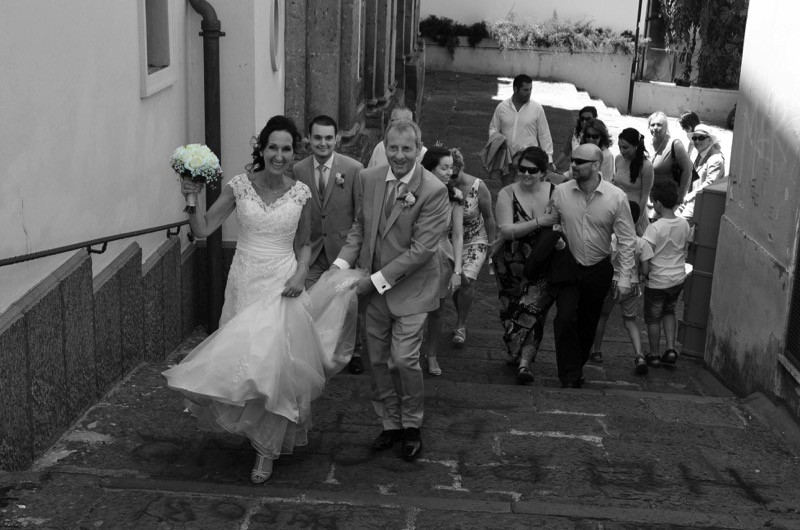 bride and groom walk up steps in Sorrento, Italy | Planner: Venice Events | via https://emmalinebride.com/real-weddings/italian-weddings-destination/