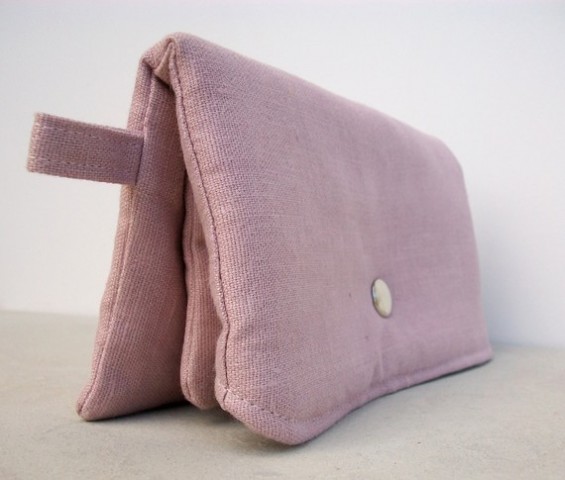 pink clutch purse side view