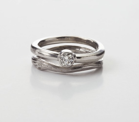 solitaire engagement ring in bezel style with twig wedding band