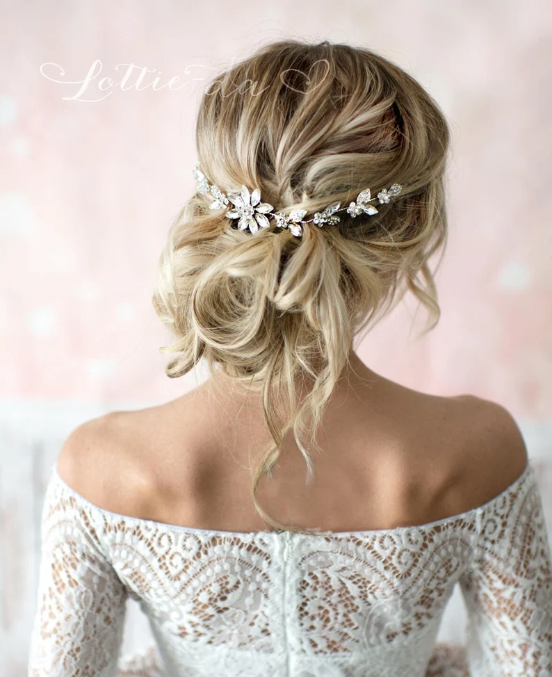 bride wearing hair vine as wedding veil alternative with updo hairstyle