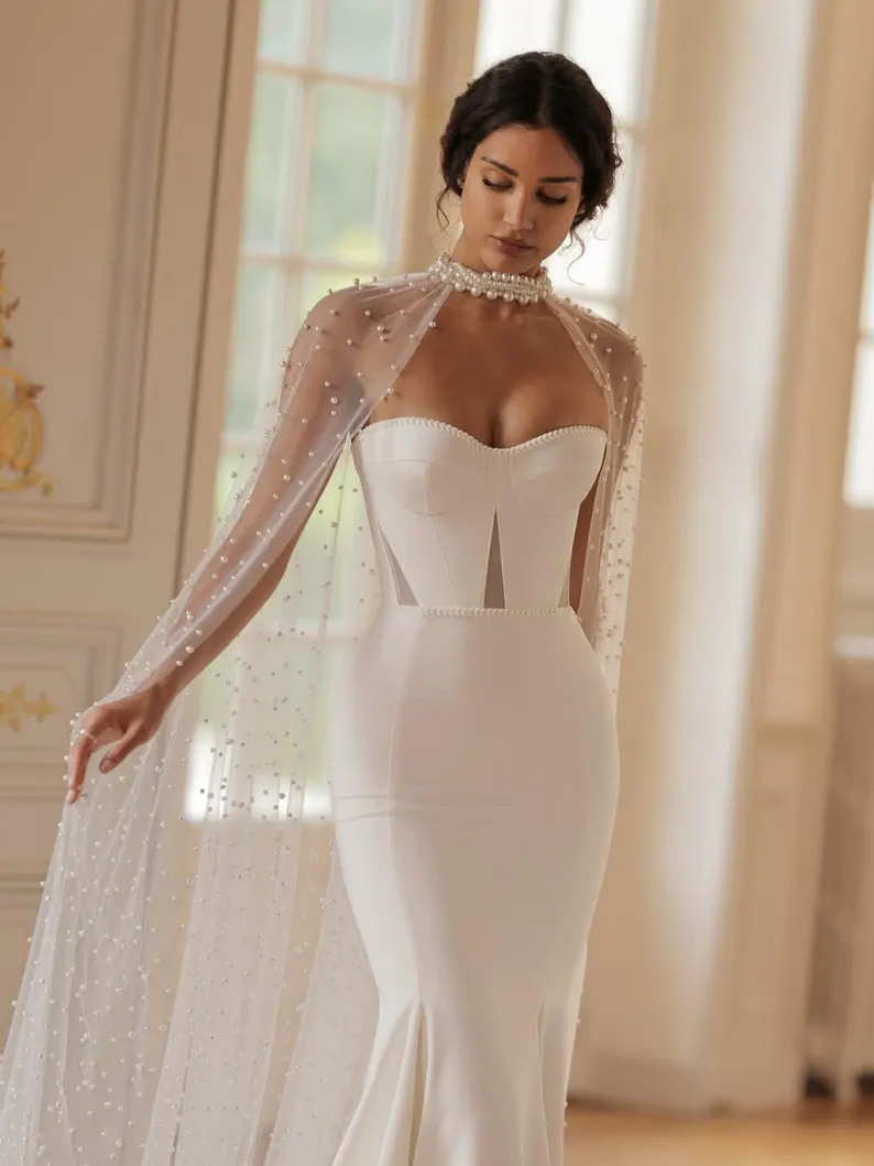 wedding veil alternative that works - bride wearing a sheer bridal cape as a wedding veil alternative