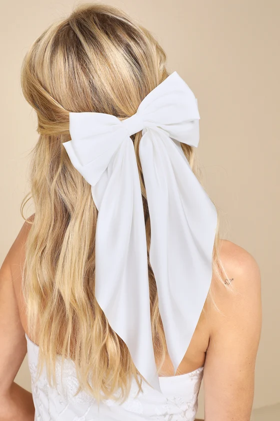 wedding veil alternative idea - modern bride wearing a bridal hair bow instead of a wedding veil for a modern look