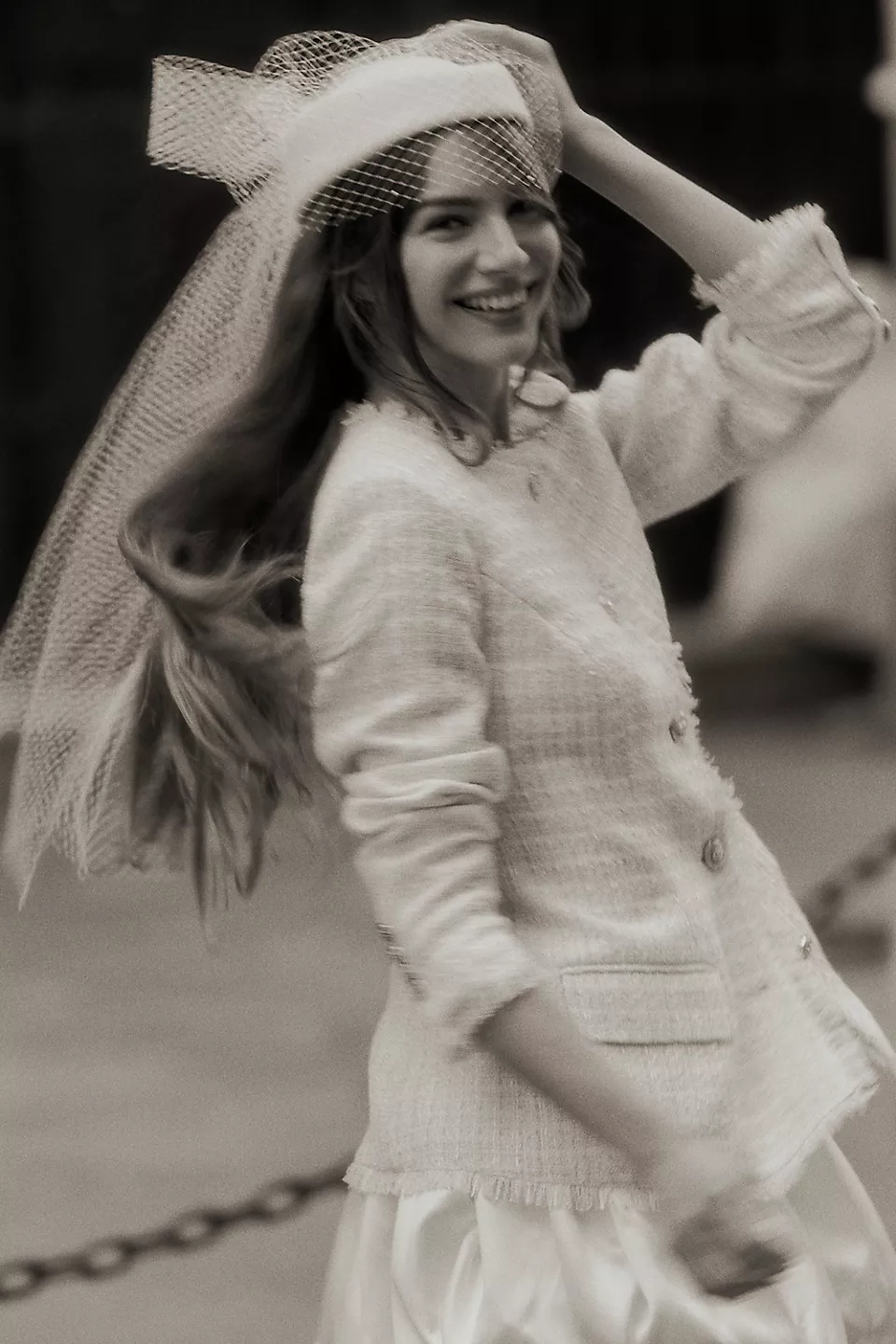 bride wearing a pillbox birdcage hat as a wedding veil alternative