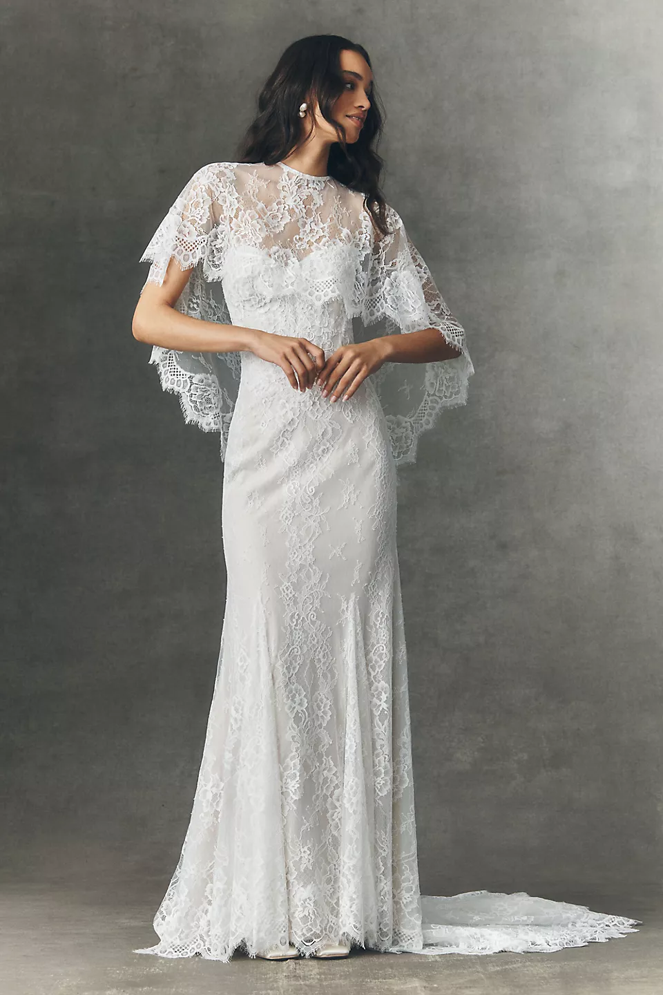 wedding veil alternative idea – bride wearing sheer lace bridal cape with wedding gown instead of veil