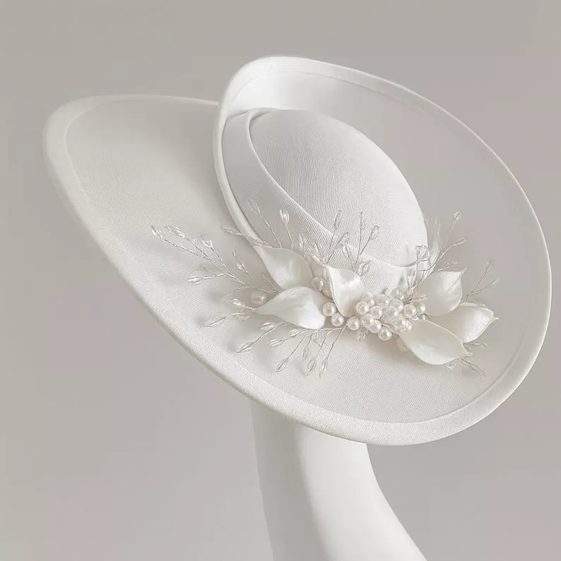 bride wearing a white satin bridal hat instead of a wedding veil
