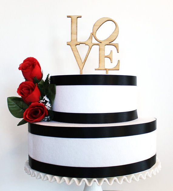 LOVE wood wedding cake topper by Tiffzippy | via Wood Themed Wedding Ideas: https://emmalinebride.com/themes/wood-themed-wedding-ideas/