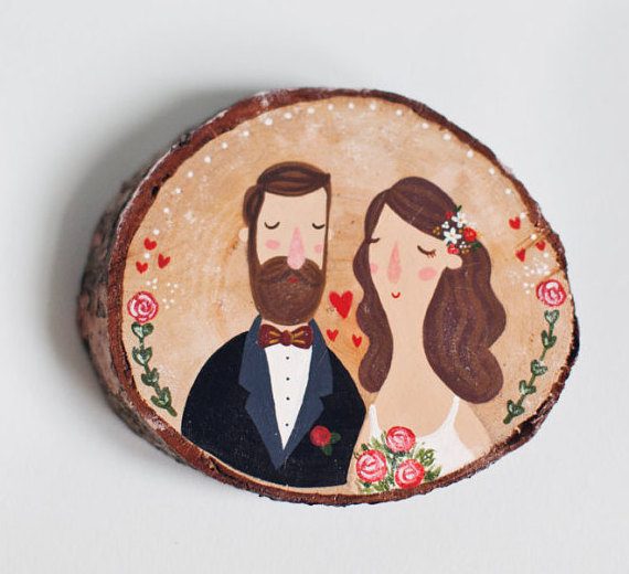 Painted wood slice decoration for whimsical weddings by The Roomba | via Wood Themed Wedding Ideas: https://emmalinebride.com/themes/wood-themed-wedding-ideas/