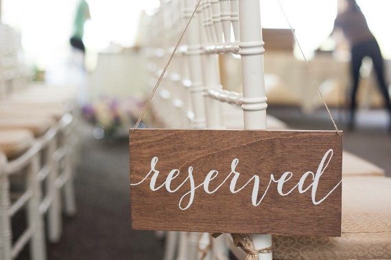 Reserved sign made of wood by Paper and Pine Co | via Wood Themed Wedding Ideas: https://emmalinebride.com/themes/wood-themed-wedding-ideas/