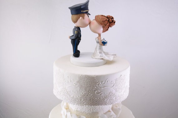 police officer figurine cake topper for weddings | figurine cake toppers that look like you | by artifice producciones | https://emmalinebride.com/reception/figurine-cake-toppers/