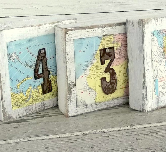 table signs made from maps | travel themed wedding ideas: https://emmalinebride.com/themes/travel-theme-wedding-ideas/
