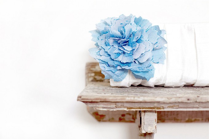 beautiful white clutch with blue flower | bridesmaid clutches instead of flowers via https://emmalinebride.com/bridesmaid/clutches-instead-of-flowers/