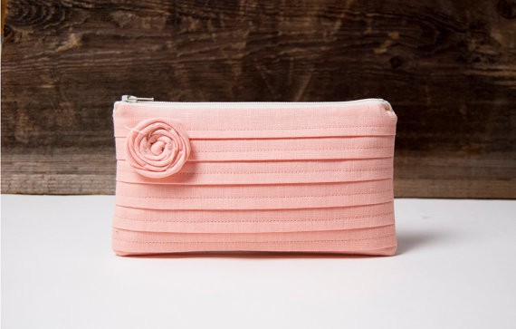 peach pink rosette bridesmaid clutch | bridesmaid clutches instead of flowers via https://emmalinebride.com/bridesmaid/clutches-instead-of-flowers/