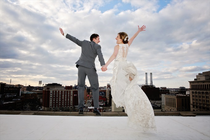 detroit_wedding_bride_groom_jump_roof Downtown Detroit Wedding - https://emmalinebride.com/real-weddings/a-beautiful-downtown-detroit-wedding-nick-jeannine/ | Michigan wedding photographer - The Camera Chick