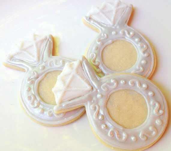 engagement ring sugar cookies by SugarMeDesserterie | via 21 Totally Fun Ring Themed Bridal Shower Ideas → https://emmalinebride.com/planning/ring-themed-bridal-shower/