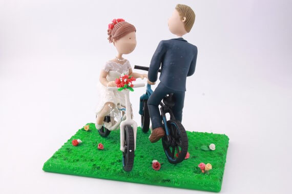 figurine cake toppers riding bikes