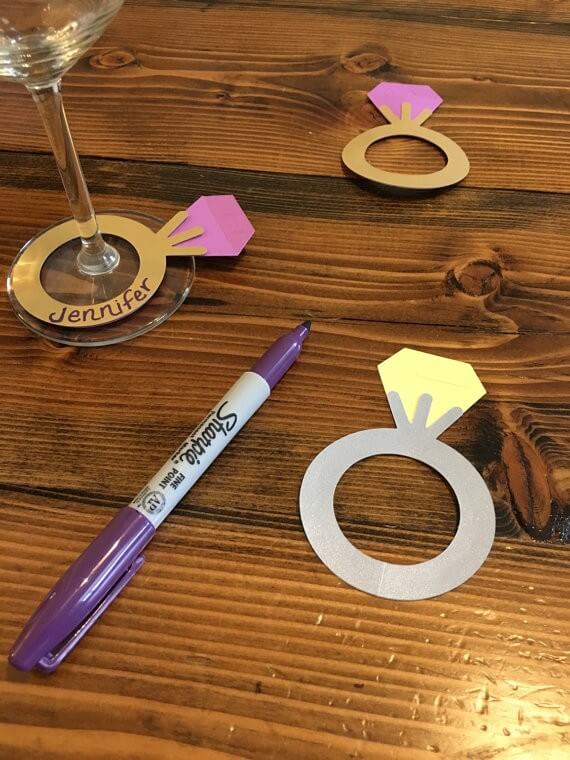paper diamond ring wine markers by tagsbyjen | via 21 Totally Fun Ring Themed Bridal Shower Ideas → https://emmalinebride.com/planning/ring-themed-bridal-shower/