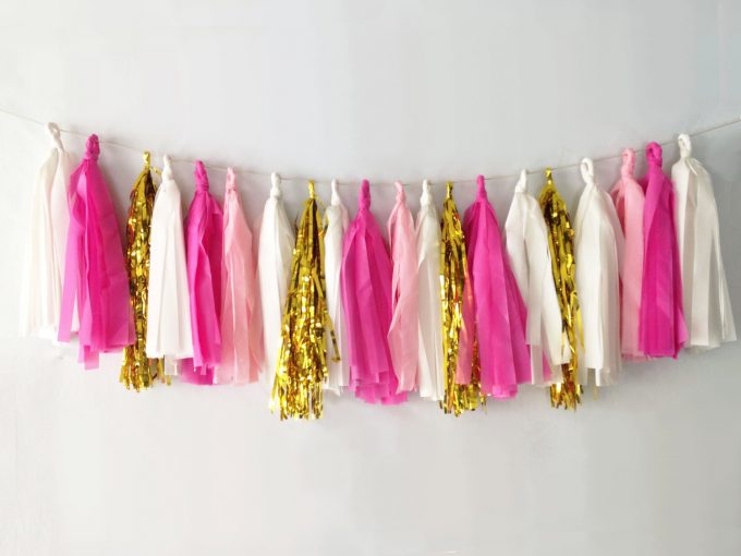 Pink tassel wedding garland by Ellenor Shop via 21 Festive Tassel Wedding Decorations & Accessories | https://emmalinebride.com/themes/tassel-wedding-decorations/
