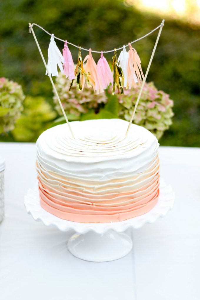 Tassel Cake Topper by Ellenor Shop via 21 Festive Tassel Wedding Decorations & Accessories | https://emmalinebride.com/themes/tassel-wedding-decorations/
