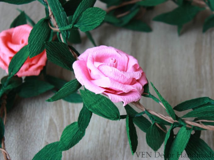Paper flower garland makes a beautiful decoration for weddings or bridal showers. By Ven Decor.