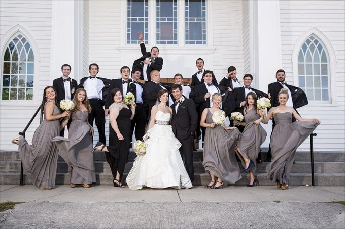 fun bridal party photograph in front of church in this Crystal Coast Wedding | North Carolina wedding photographed by Ellen LeRoy Photography - https://emmalinebride.com/real-weddings/breathtaking-crystal-coast-wedding-mara-will-married/