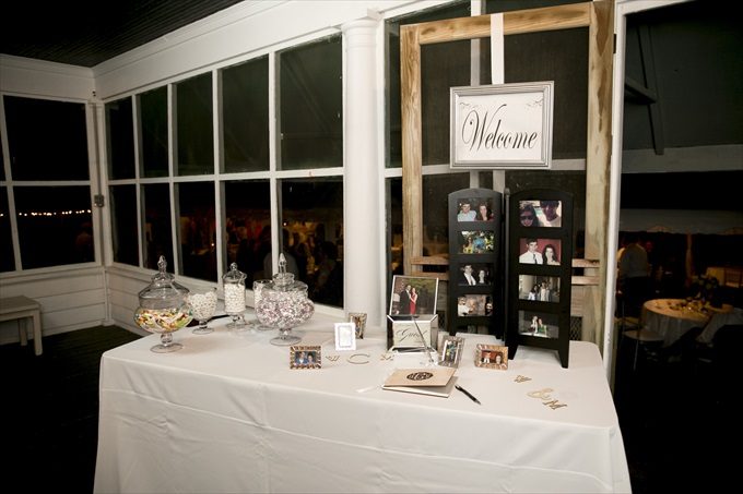 reception table with candy and photos in this Crystal Coast Wedding | North Carolina wedding photographed by Ellen LeRoy Photography - https://emmalinebride.com/real-weddings/breathtaking-crystal-coast-wedding-mara-will-married/