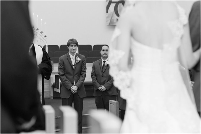 groom watches this bride walk down the aisle in this Sedgefield Country Club wedding| Greensboro, North Carolina winter wedding photographed by Michelle Robinson Photography - https://emmalinebride.com/real-weddings/sedgefield-country-club-wedding/
