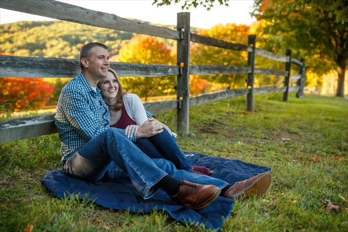 engaged couple on picnic blanket during engagement session| engagement photography by Butler Photography LLC.| Love Fall Weddings? See this Somers, CT Engagement Session - https://emmalinebride.com/real-weddings/love-the-fall-weddings-see-this-somers-ct-engagement-session/