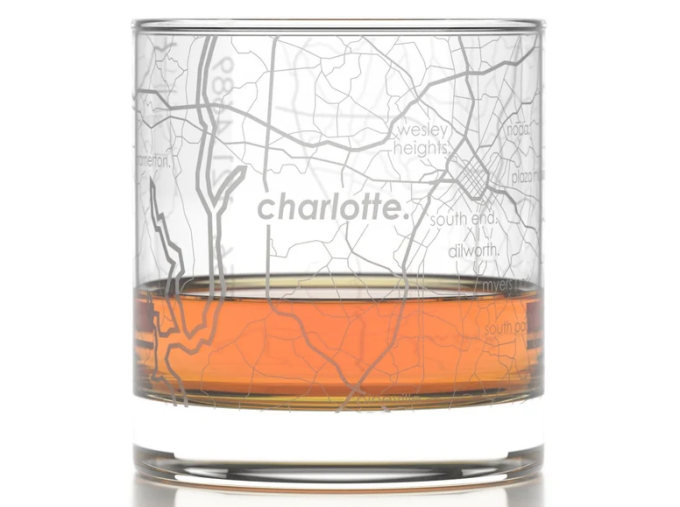 rocks glass with map of city