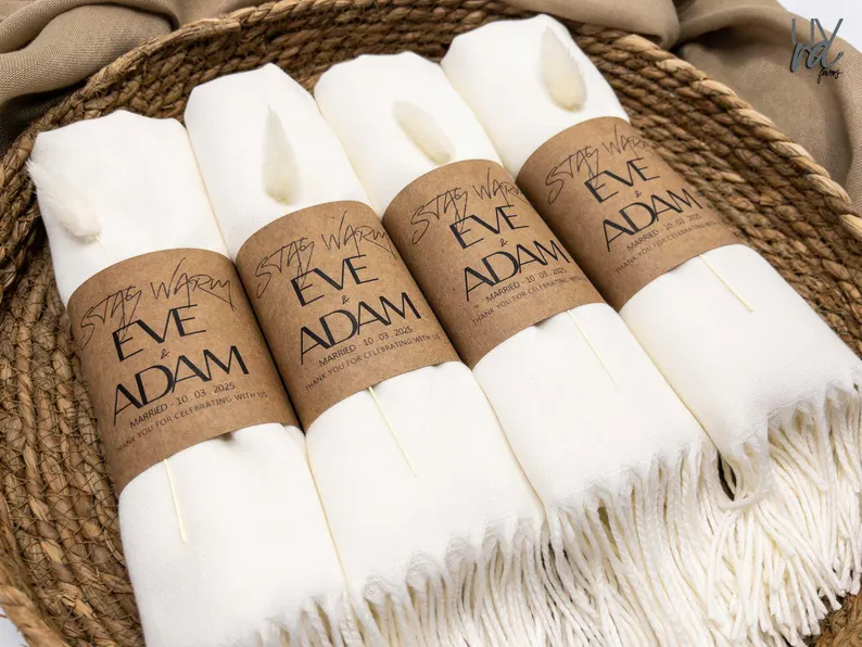 bulk blankets for wedding guests stacked in crates or on woven basket