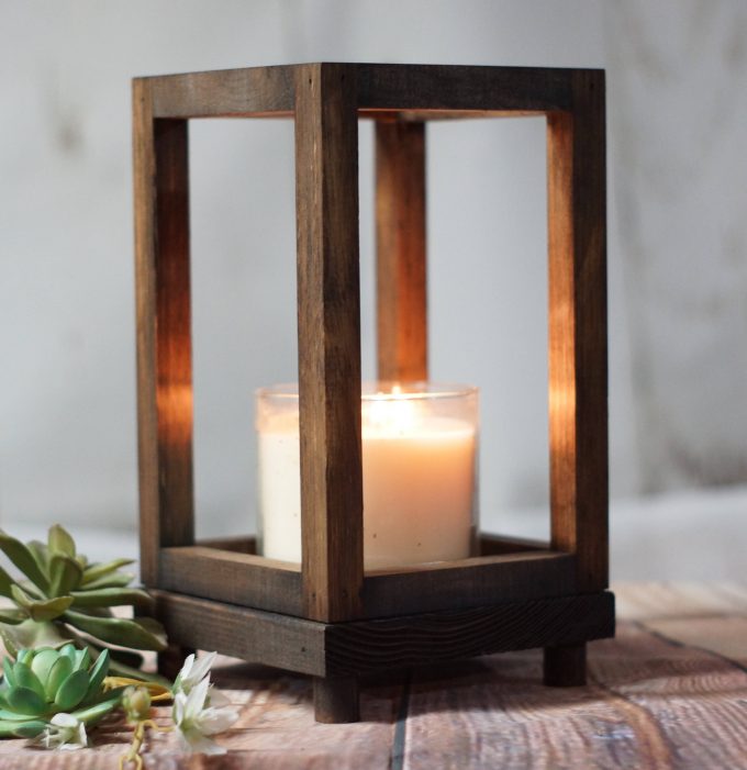 votive candle inside wood lantern