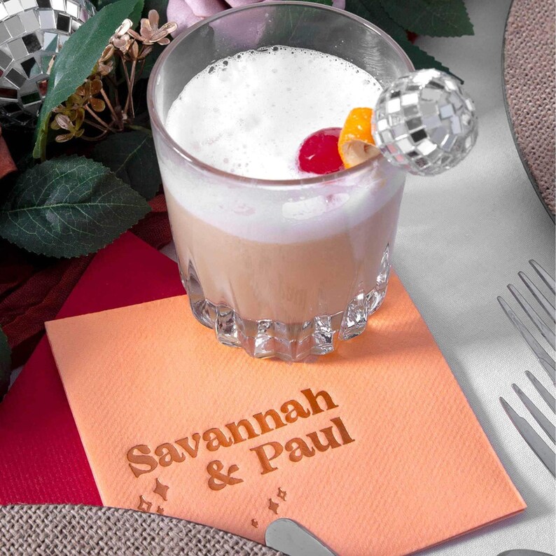 personalized cocktail napkins at a wedding bar