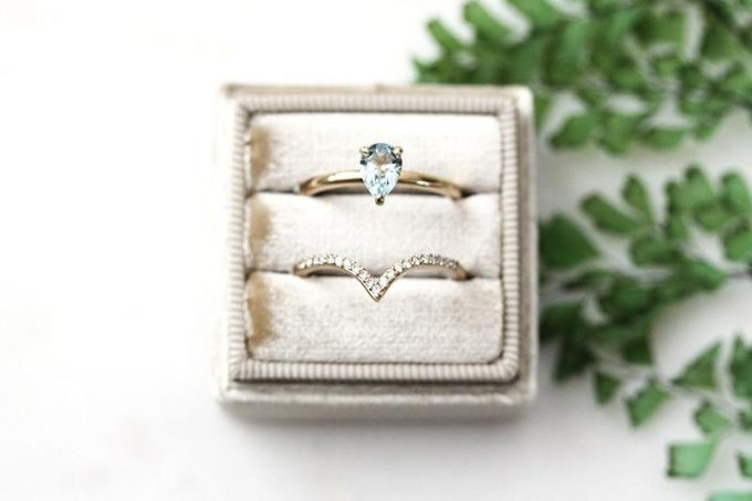 moissanite cushion cut engagement ring and aquamarine ring