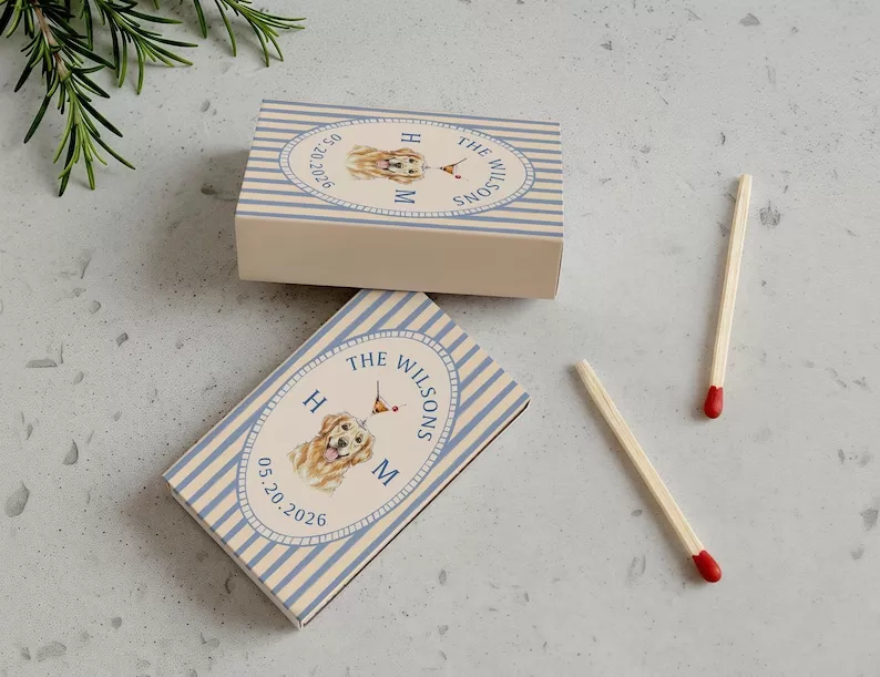 wedding matchbook favors with dog placed at guest table settings