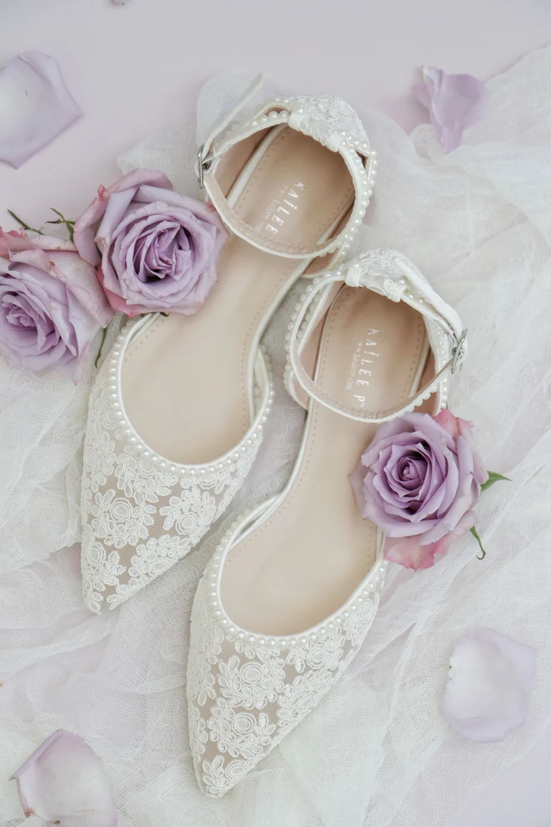 pointed toe ivory wedding flats with an elegant bridal shoe design
