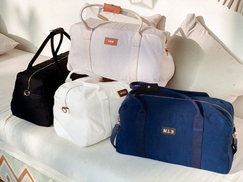personalized bridesmaid duffel bags with leather name tags