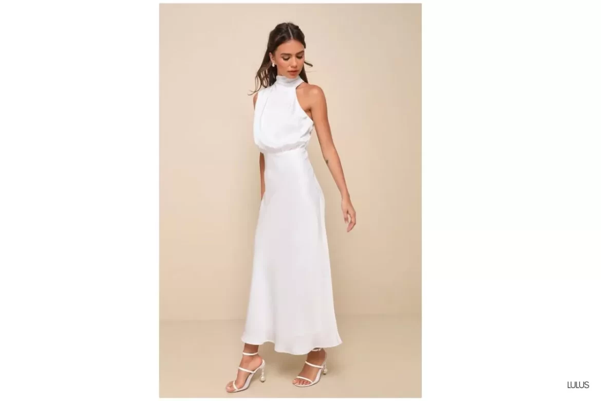 bride wearing a second dress for wedding reception in a short white mini dress dancing at reception