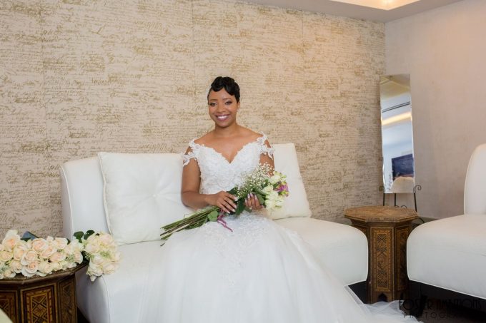bride lounging with bouquet of roses - le club avenue wedding