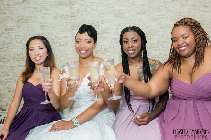 bride and bridesmaids toasting champagne - le club avenue wedding