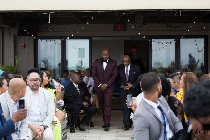 groom walking down the aisle with the officiant  - le club avenue wedding