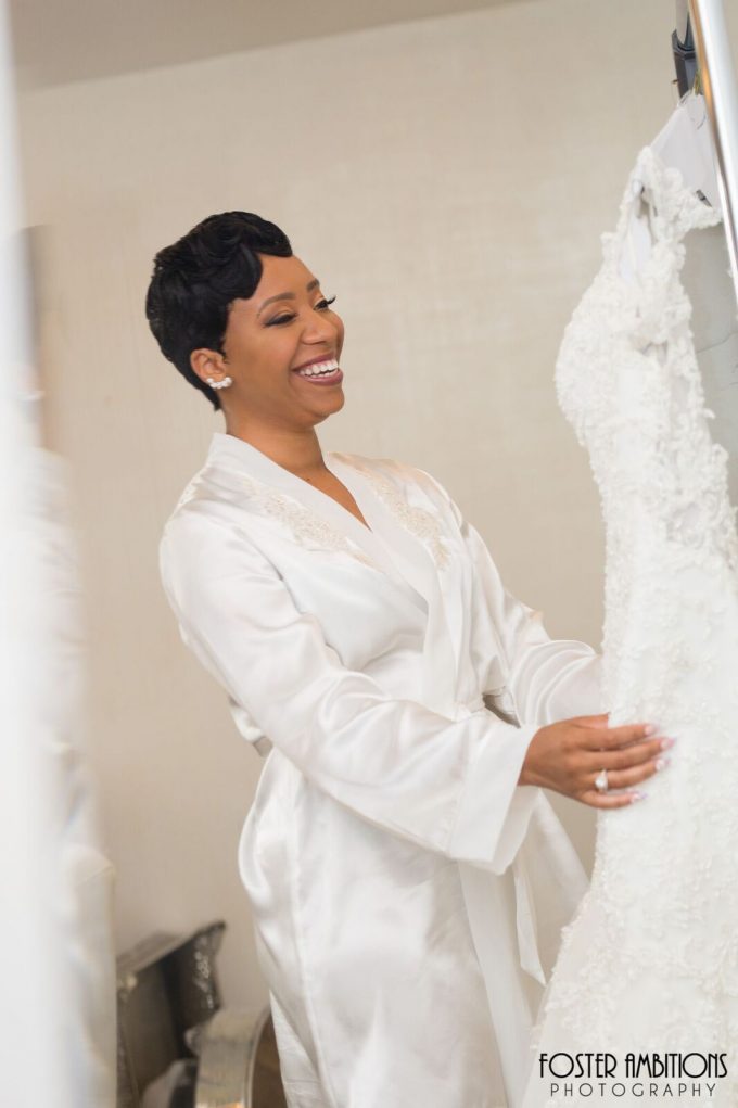 the bride smiling as she sees her dress - le club avenue wedding