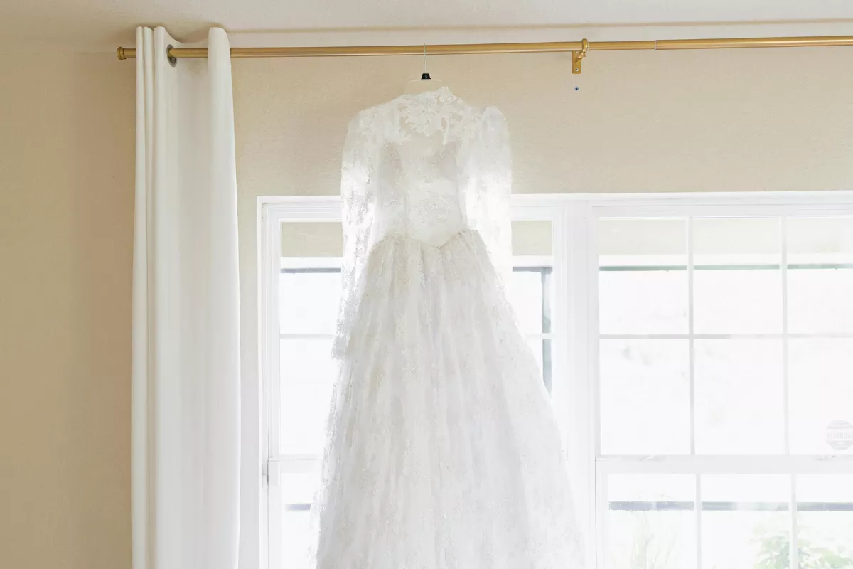 wedding dress hanging safely in a hotel room