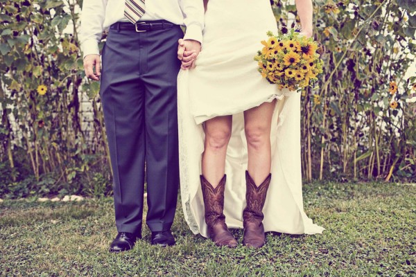 bride wearing boots with wedding dress