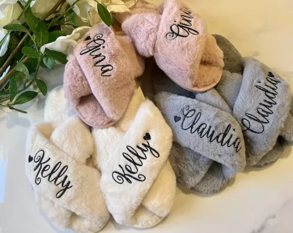 close-up of soft fuzzy bridesmaid slippers in neutral wedding colors