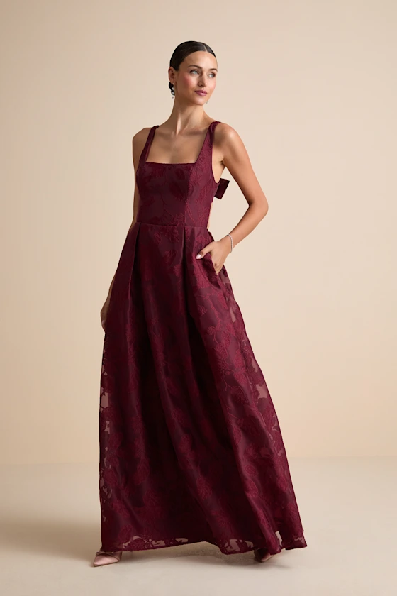 Burgundy bridesmaid dress paired with navy wedding suit