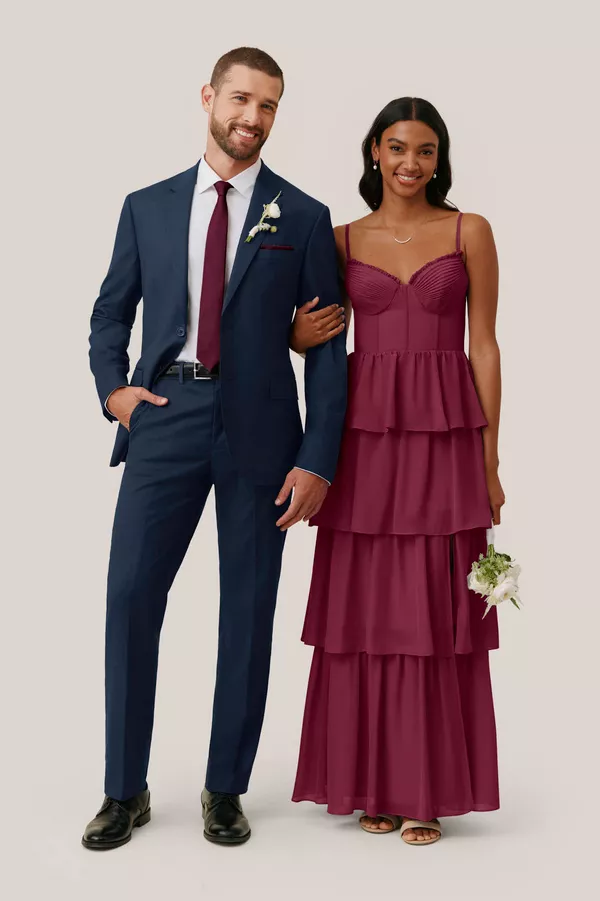 Plum purple bridesmaid dress paired with navy suit